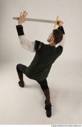 KEETA KNEELING POSE WITH SWORD